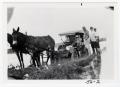 Thumbnail image of item number 1 in: '[Mules Pulling Drowned Car From Flooded Road]'.