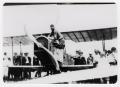 Photograph: [Man Entering Cockpit of Airplane at Beasley Field]