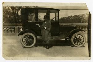 Primary view of object titled '[Woman Standing in Front of a Car]'.