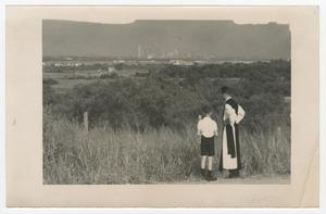 Primary view of object titled '[Student and Monk Look at Dallas Skyline]'.