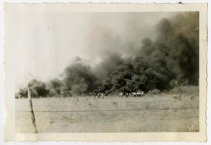 [Photograph of People in Front of Smoke Line]