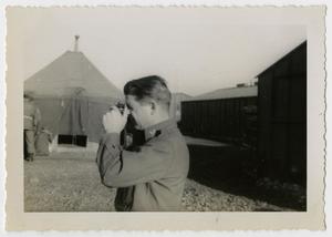 Primary view of object titled '[Photograph of Soldier Taking Pictures]'.