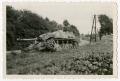 Photograph: [Tank on Side of Dirt Road]