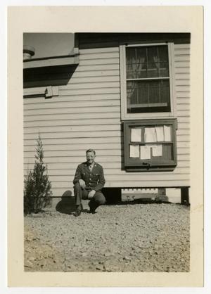 [Photograph of Soldier Outside Building]