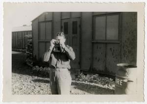 [Photograph of Soldier Taking Photos]
