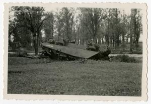 [Photograph of Overturned Tank]