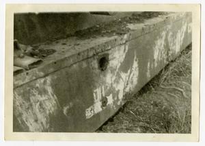 [Photograph of Shell Hole in Tank]