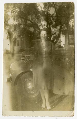 [Woman Standing by a Car]