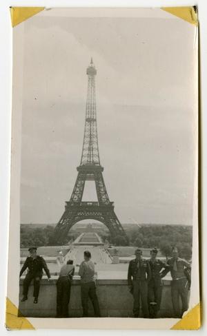 [Photograph of Soldiers and the Eiffel Tower]