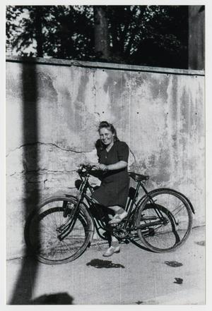 Primary view of object titled '[Photograph of Young Woman on Bicycle]'.