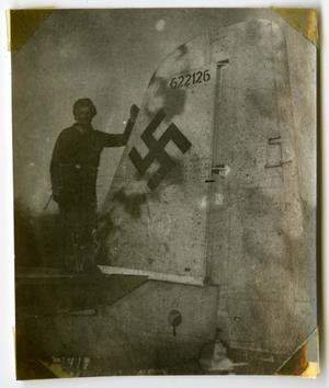 [Photograph of Soldier on Wrecked Plane]