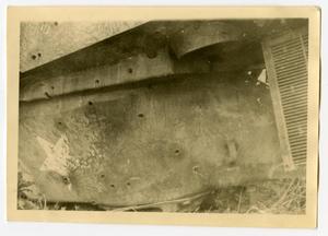 [Photograph of Bullet Holes in Tank]