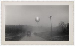 [Photograph of Barrage Balloon and Army Vehicles]