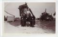 Thumbnail image of item number 1 in: '[N. C. and Tommy Berndt Working on Cotton Picker]'.