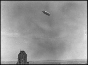 Primary view of object titled '[Dirigible Over Bassett Tower]'.