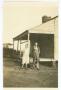 Photograph: [Henry and Florence Clountz by a House]