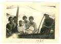 Photograph: [People Sitting in a Covered Boat]