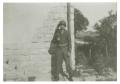 Photograph: [Photograph of Soldier Outside Building]