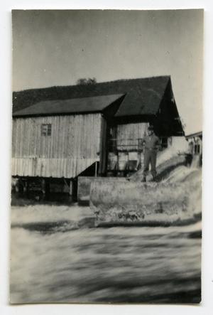 Primary view of object titled '[Photograph of Henry Rohrbeck on a Dam]'.