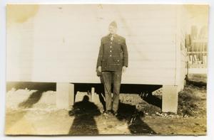 [Photograph of Soldier Outside Barracks]