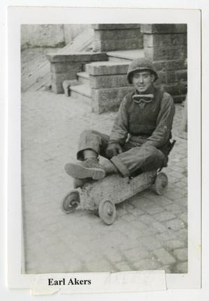 [Earl Akers Sitting on a Toy Go-Cart]