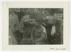 [Photograph of Soldier Giving Haircut]