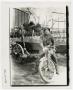 Photograph: [Photograph of a Soldier on a Motorbike]