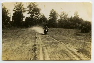 Primary view of object titled '[Photograph of Soldier on Motorcycle]'.