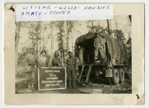 [Group of Soldiers Outside a Supply Truck With a Sign]