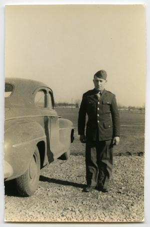 [Photograph of Soldier and Car]