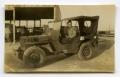 Photograph: [Photograph of Soldier in Jeep]