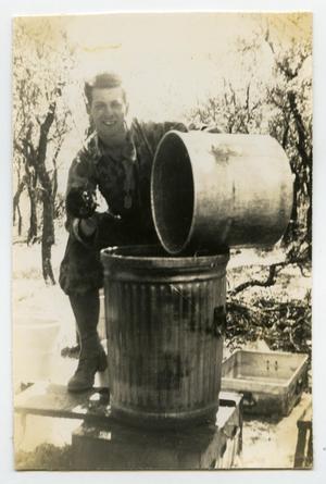 [Photograph of Soldier Cleaning Pot]
