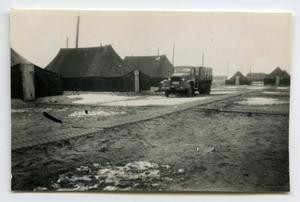 [Photograph of Truck in Military Camp]