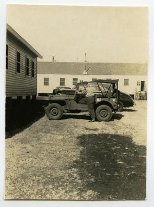 [Photograph of Henry Rohrbeck in Jeep]