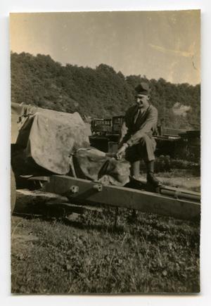 [Photograph of Soldier with Artillery Piece]