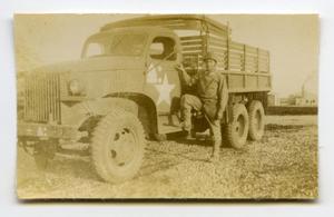 [Photograph of Soldier with Truck]