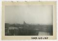 Photograph: [Photograph of American Flag and Life Rafts on Ship's Deck]