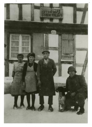 [Photograph of Soldier and Family at Bakery]