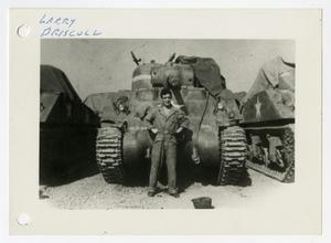Primary view of object titled '[Photograph of Larry Driscoll and Tank]'.
