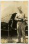Photograph: [Photograph of Henry Rohrbeck with Thompson Submachine Gun]
