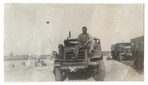 [Soldier Sitting on the Hood of Truck]