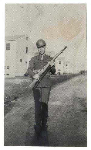 [Uniformed Soldier Holding Rifle]