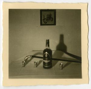[Photograph of Bottle on Table]
