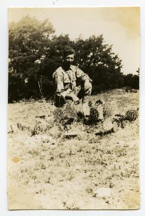 [Photograph of Soldier and Cactus]
