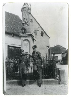 [Two Soldiers Near European Building]