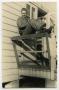 Photograph: [Photograph of Soldier on Porch]