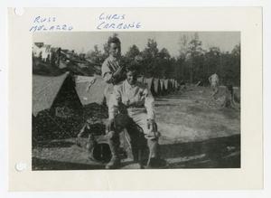 [Photograph of Soldier Giving Haircut in Camp]