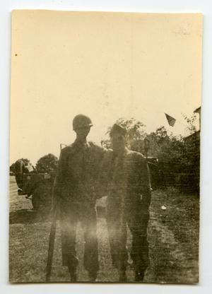 [Photograph of Soldiers and Jeep]