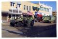 Photograph: [Tanks and Trucks in Dedication Parade]