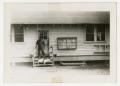Photograph: [Photograph of Soldier and Dogs Outside C Company Mess Hall]